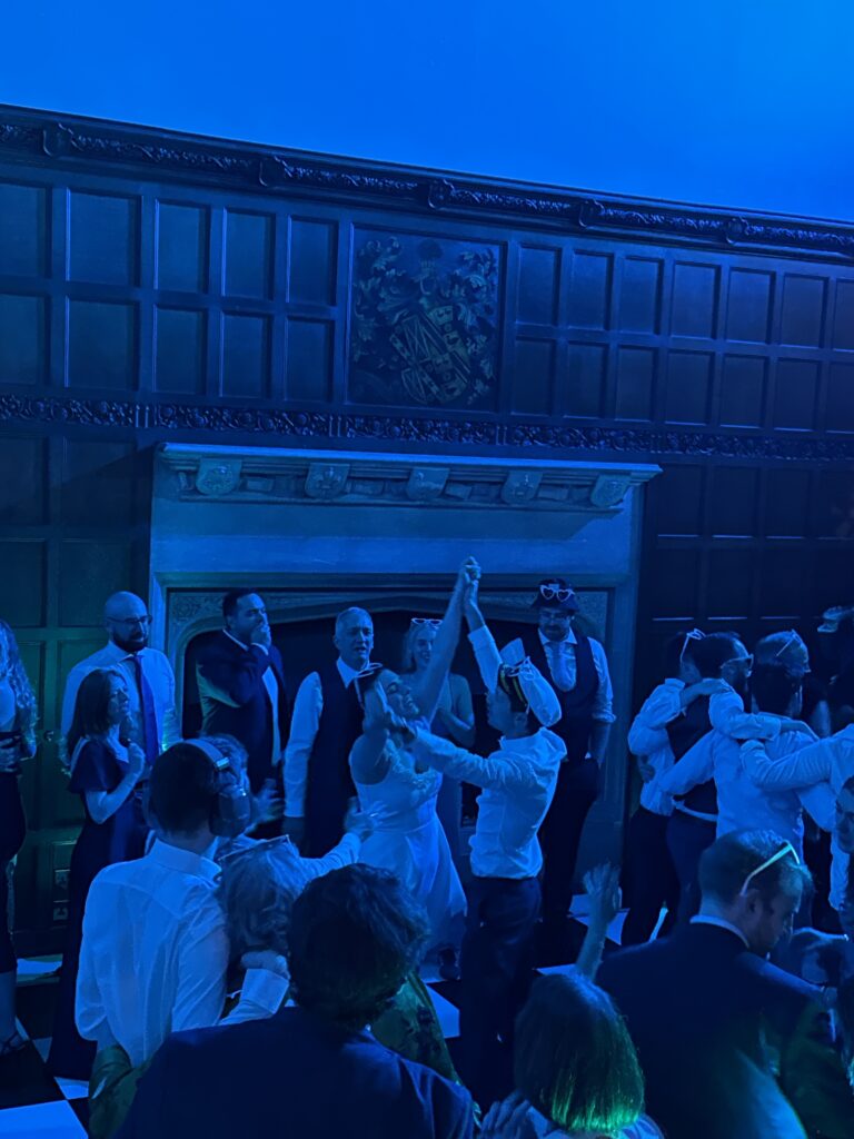 Wedding guests celebrating on the dancefloor at a Mr Beats wedding DJ reception in Essex